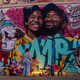 A woman looks at a mural by the artists Muck Rock and Mr79lts showing Kobe Bryant and his daughter Gianna Bryant, who were killed with seven others in a helicopter crash on January 26, in Los Angeles on January 27, 2020.